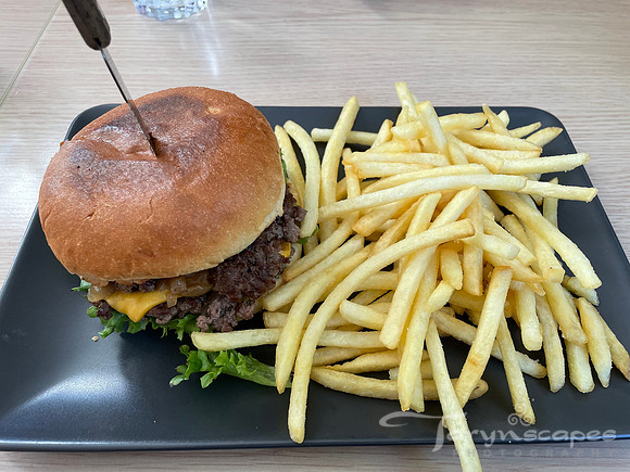 A big juicy cheeseburger with skinny fries