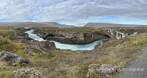 Horseshoe bend in the river with overcast skies above.