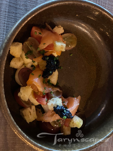bowl with black and golden bits, possibly smoked salmon