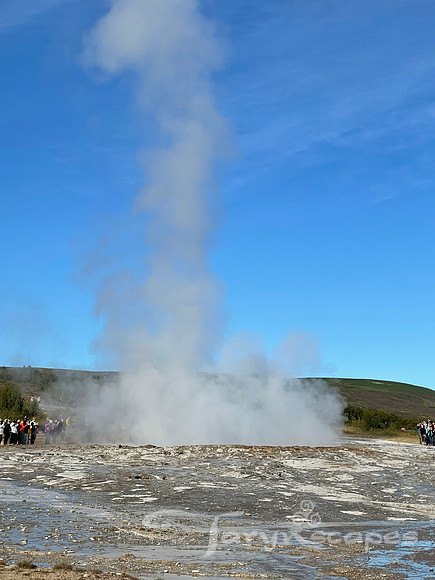 Steam rises up from a geyser