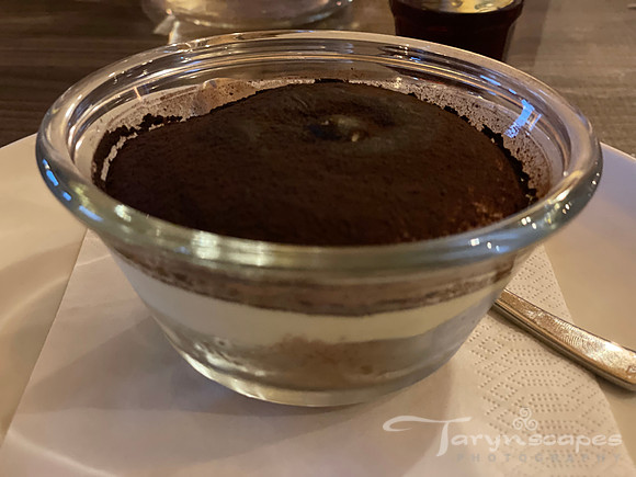 Glass bowl of dark chocolate dessert