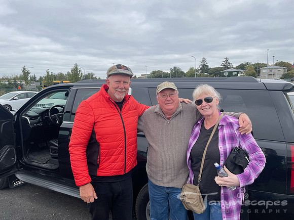 Our driver, my dad and my mom in front of the suburban.