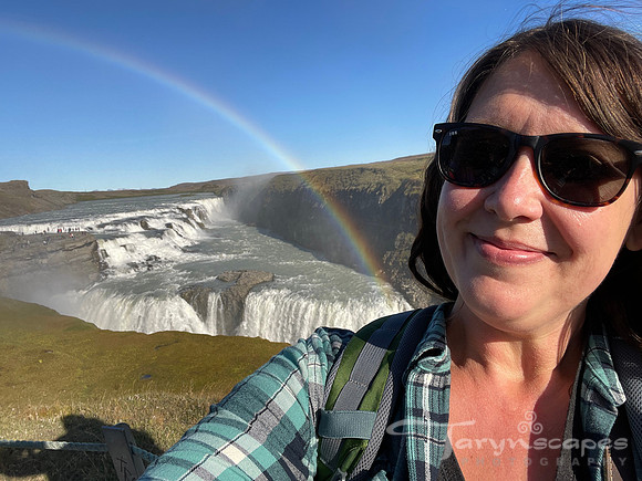 My smiling face in front of gulfoss with a rainbow