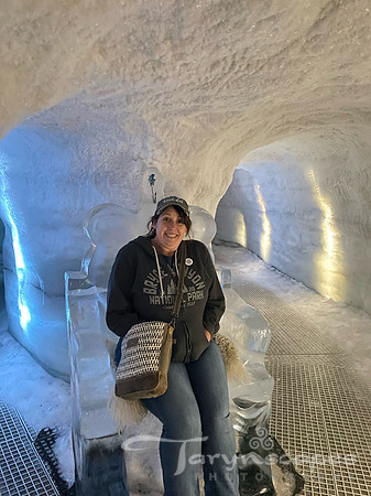 Me sitting on a ice thrown with animal fur throw, looking a little cold